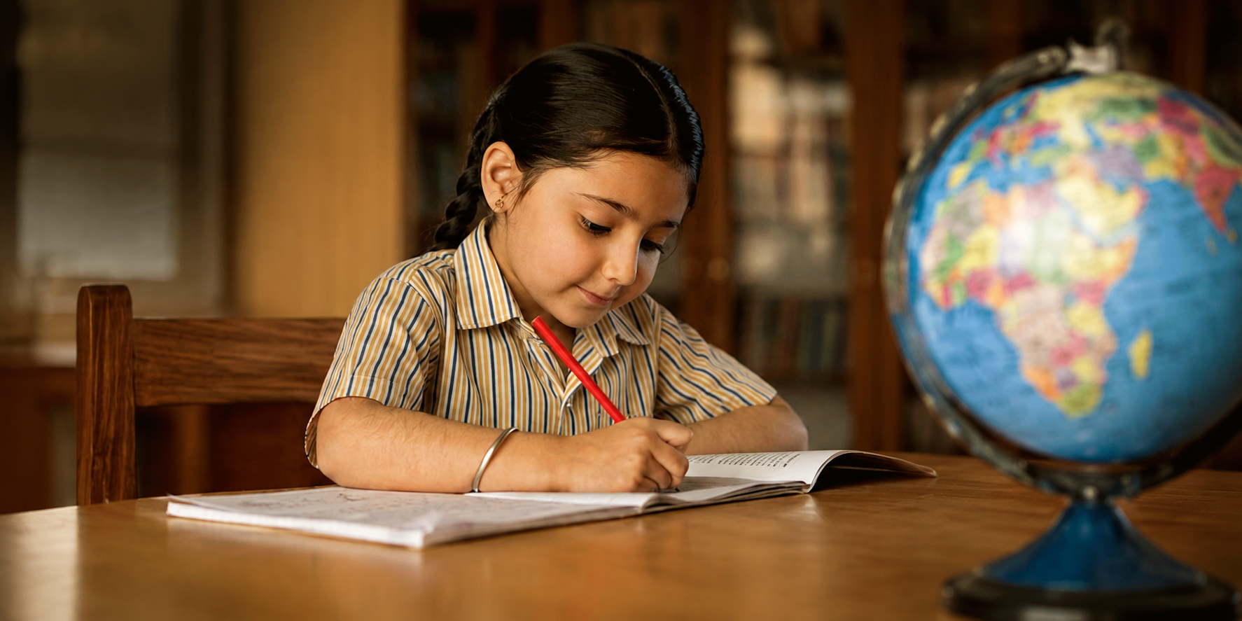 Student writing in a notebook