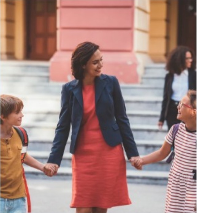 Parent walking children to school